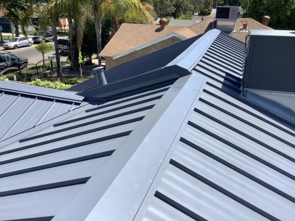 Tile and metal roofing detail on a custom home