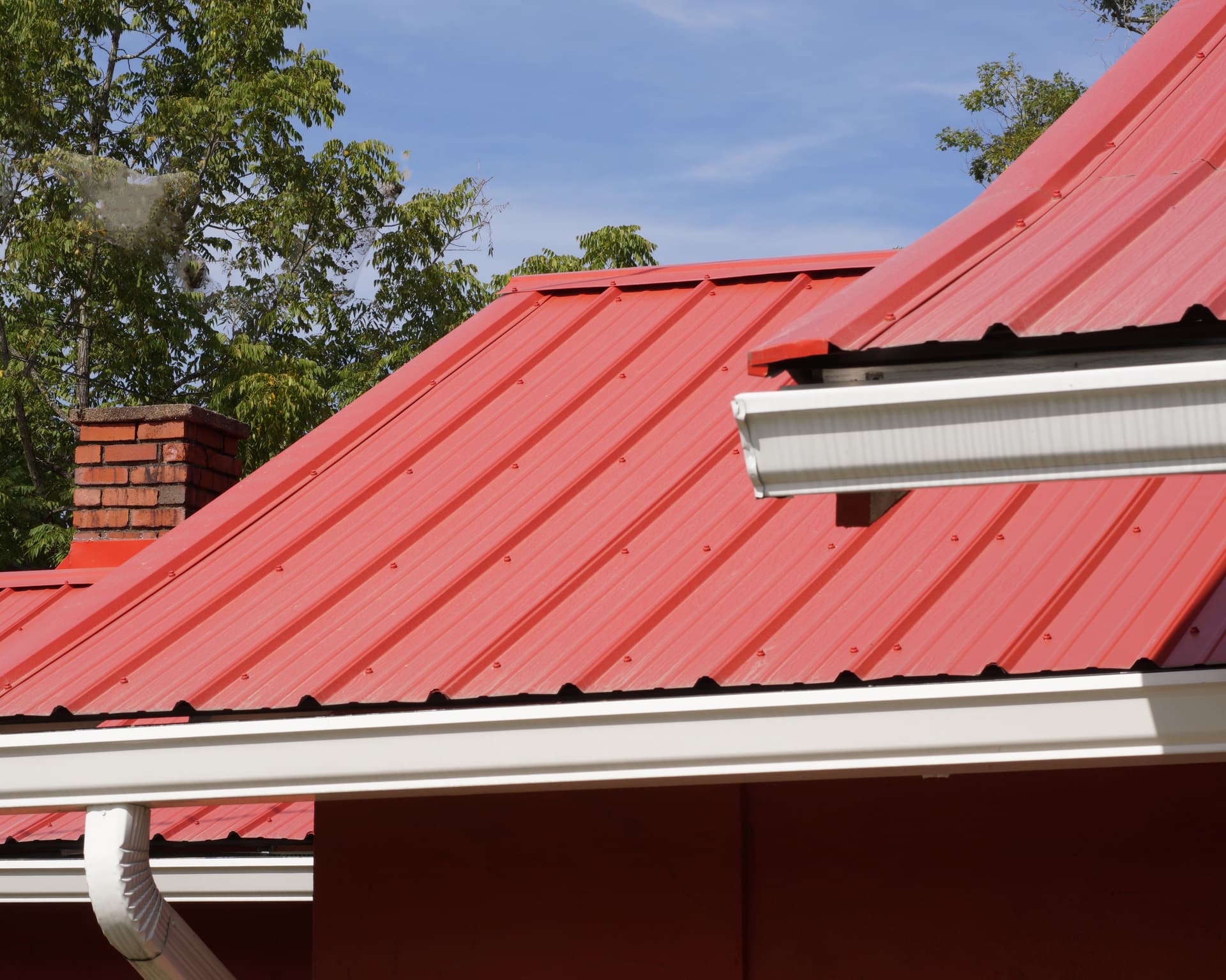Red metal roof on a residential property